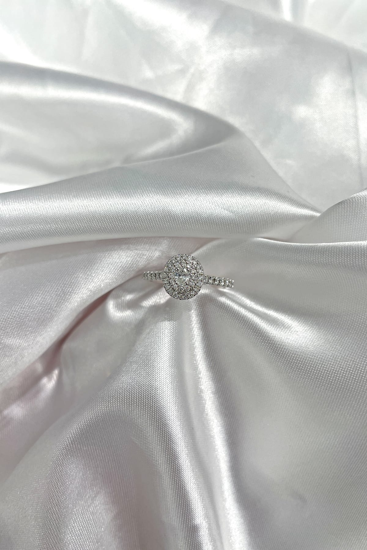 18 Carat Gold Double Oval Diamond Halo Engagement Ring With Diamond Band available at LeGassick Diamonds and Jewellery Gold Coast, Australia.
