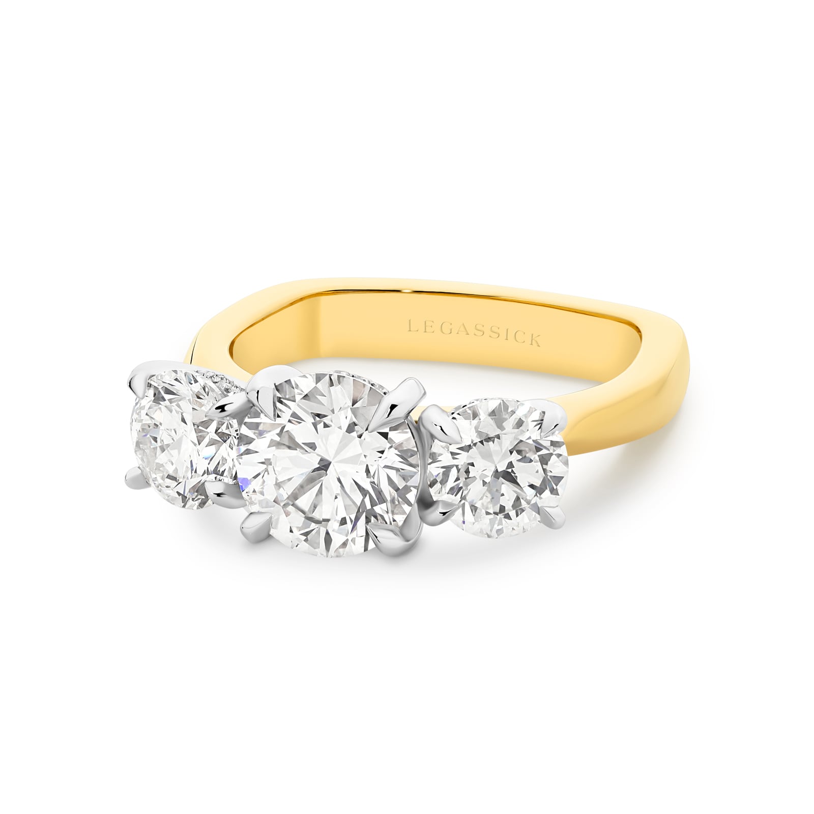 Abbagail is a stunning diamond trilogy ring with over 4 carats of spectacular round brilliant diamonds and a hidden diamond halo. She was designed and handcrafted by LeGassick's Master Jewellers and a member of the Beyond Luxury Collection.