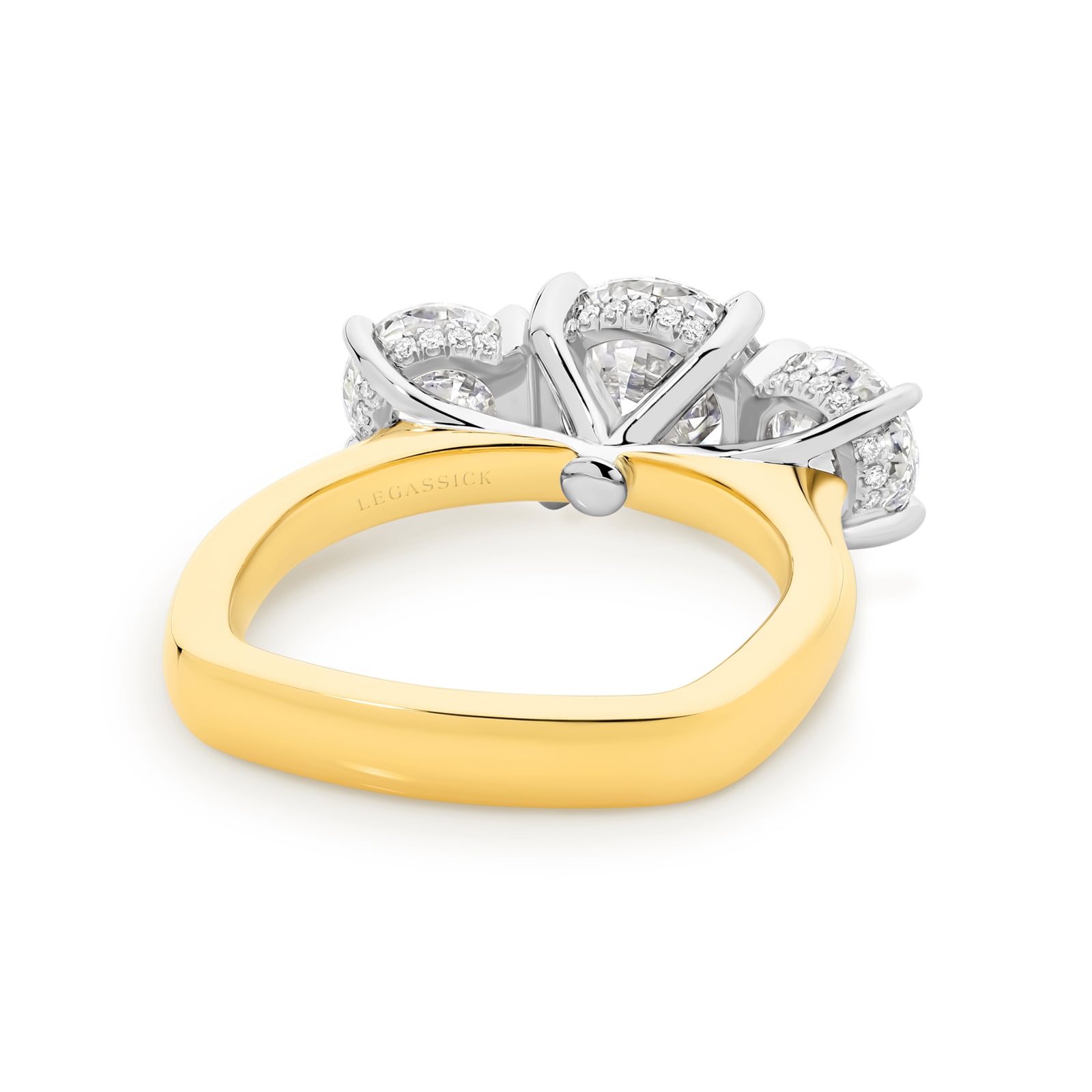 Abbagail is a stunning diamond trilogy ring with over 4 carats of spectacular round brilliant diamonds and a hidden diamond halo. She was designed and handcrafted by LeGassick's Master Jewellers and a member of the Beyond Luxury Collection.