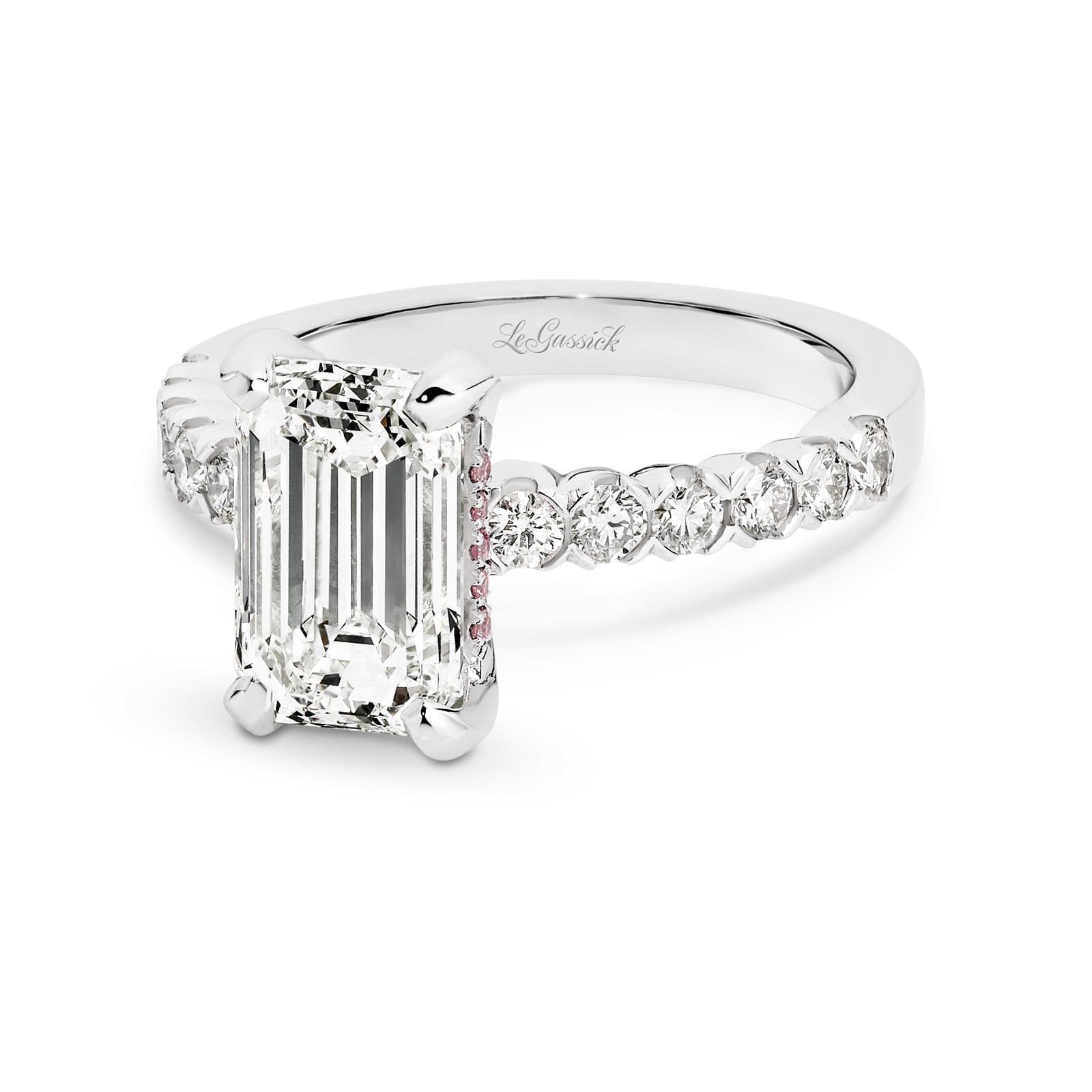 Athena features a 3.02 carat Emerald-cut solitaire diamond, handcrafted in platinum and supported by 12 round brilliant cut diamonds in the band totalling 0.48ct. Athena is softened by a fine ribbon of rose gold around the white diamond, delicately set with rare Argyle pink diamonds. She was designed and handcrafted by LeGassick's Master Jewellers, Gold Coast, Australia.