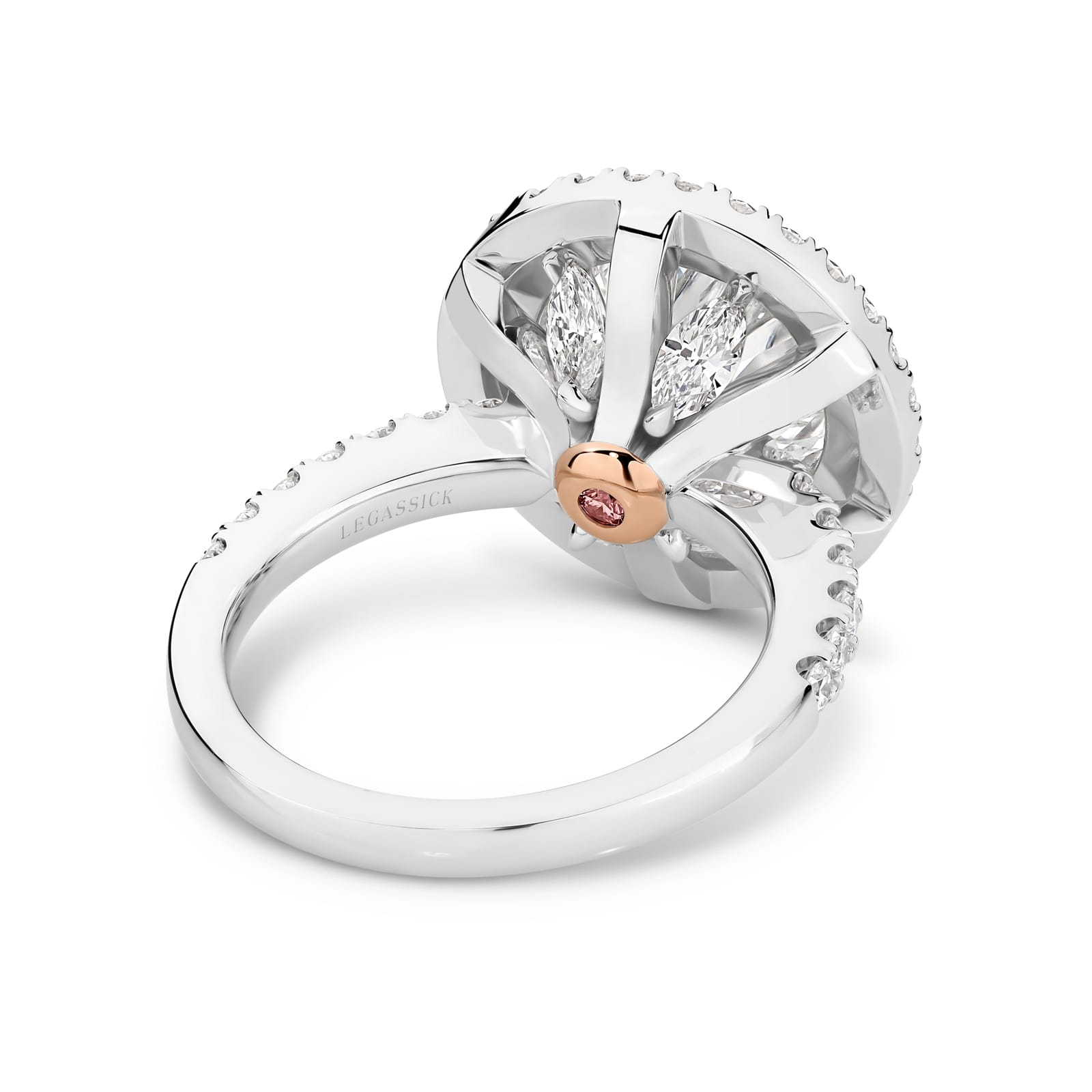 Cleopatra has a stunning 4.51ct round brilliant cut centre diamond surrounded by an inner halo of 24 rare, natural Argyle pink diamonds that, in turn, are showcased by an outer halo of fine white diamonds. She was designed and handcrafted by LeGassick's Master Jewellers, Gold Coast, Australia.