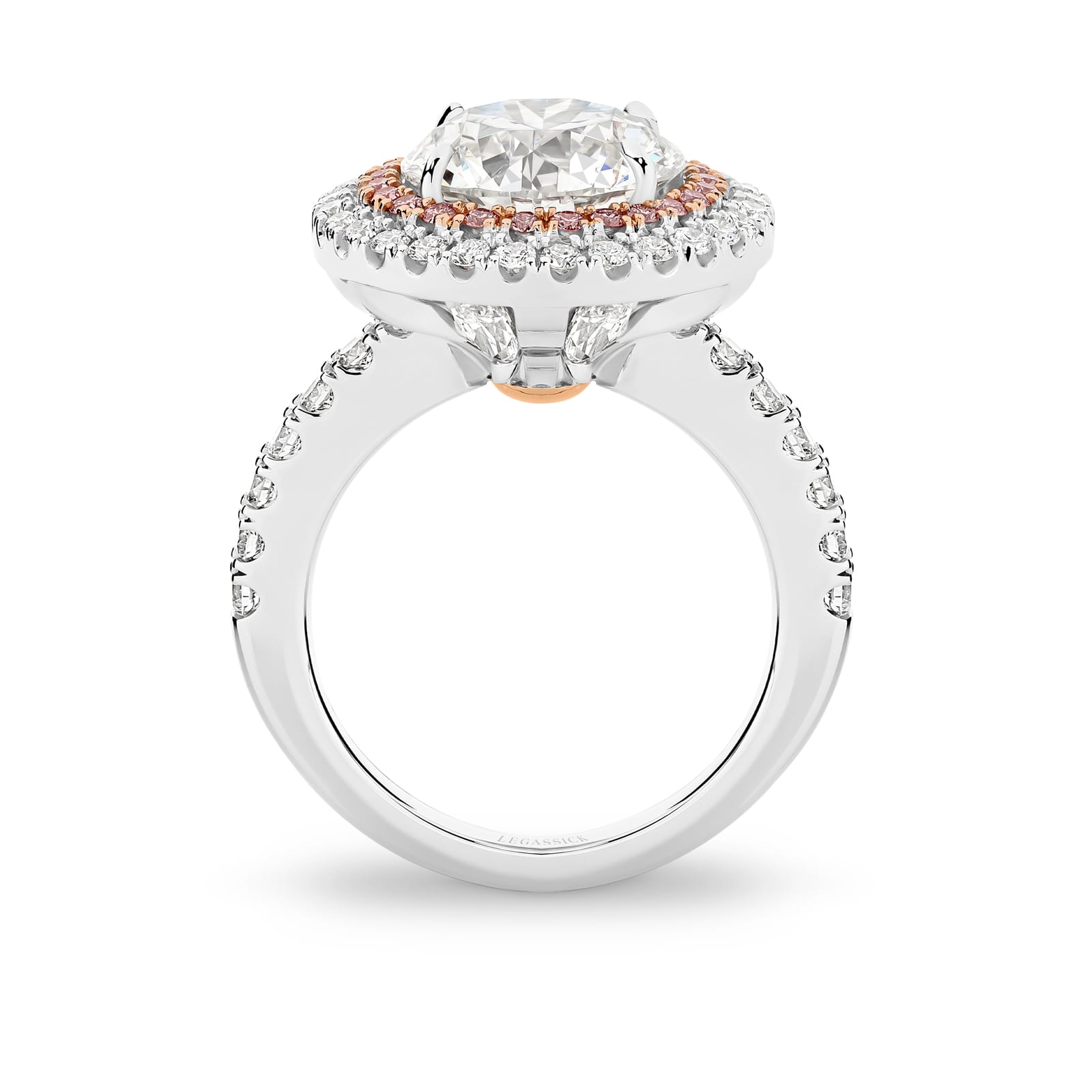 Cleopatra has a stunning 4.51ct round brilliant cut centre diamond surrounded by an inner halo of 24 rare, natural Argyle pink diamonds that, in turn, are showcased by an outer halo of fine white diamonds. She was designed and handcrafted by LeGassick's Master Jewellers, Gold Coast, Australia.