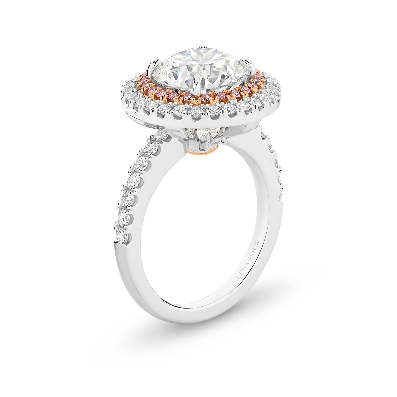 Cleopatra has a stunning 4.51ct round brilliant cut centre diamond surrounded by an inner halo of 24 rare, natural Argyle pink diamonds that, in turn, are showcased by an outer halo of fine white diamonds. She was designed and handcrafted by LeGassick's Master Jewellers, Gold Coast, Australia.