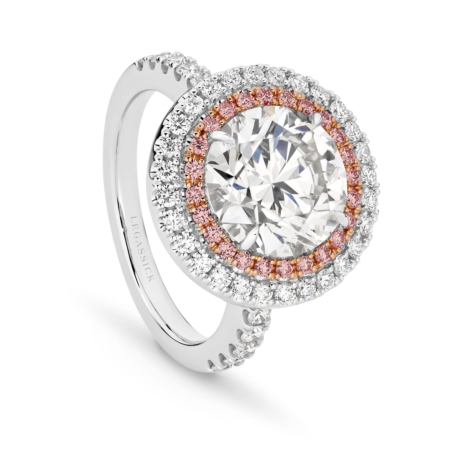Cleopatra has a stunning 4.51ct round brilliant cut centre diamond surrounded by an inner halo of 24 rare, natural Argyle pink diamonds that, in turn, are showcased by an outer halo of fine white diamonds. She was designed and handcrafted by LeGassick's Master Jewellers, Gold Coast, Australia.