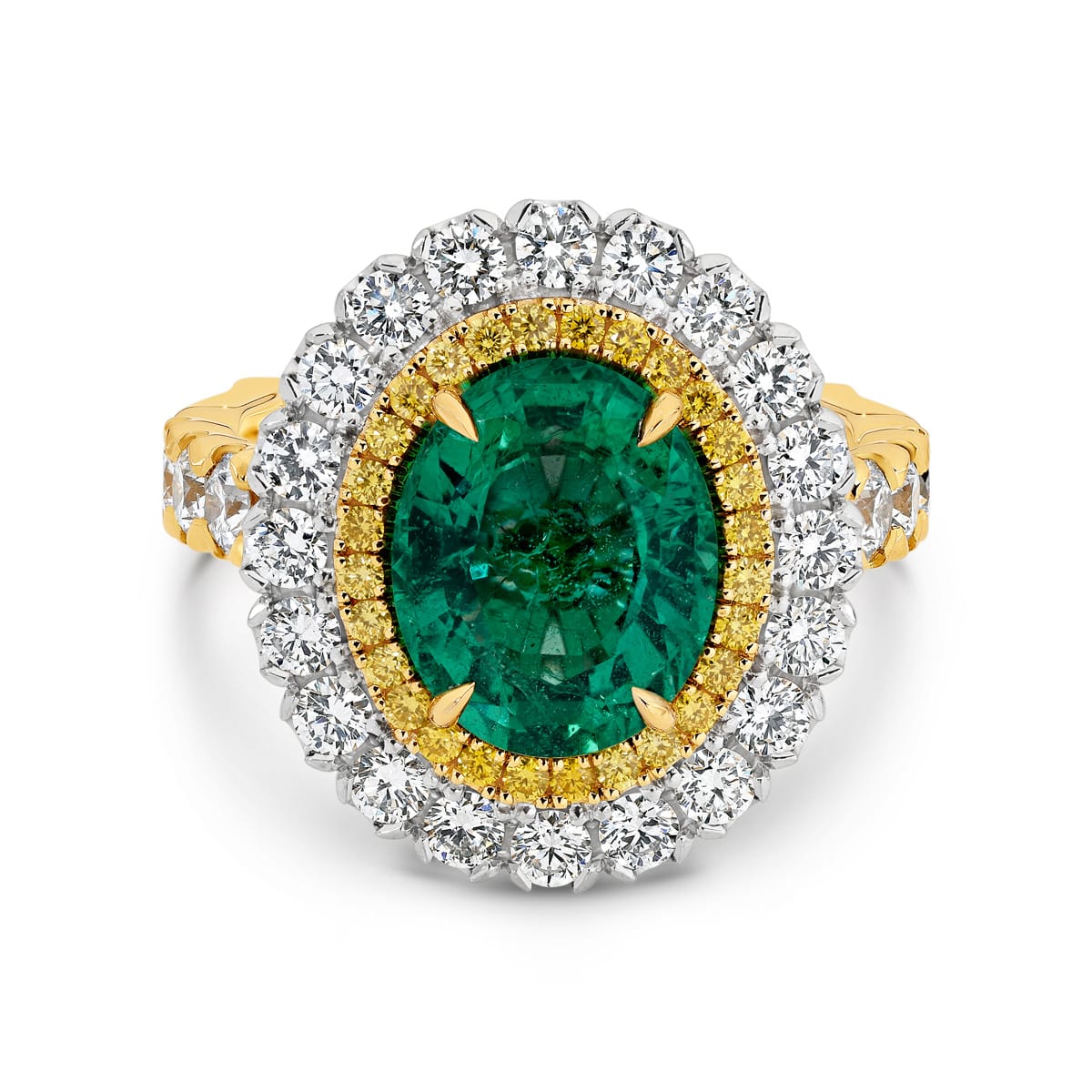 Kai-Mana features natural 3.79 carat oval-cut emerald enhanced by a halo of 28 fancy intense natural yellow diamonds. Surrounded the yellow diamonds in a halo of 20 white round billing cut diamonds. Kai-Mana also features 8 round brilliant cut white diamonds on the band. She was designed and handcrafted by LeGassick's Master Jewellers, Gold Coast, Australia.