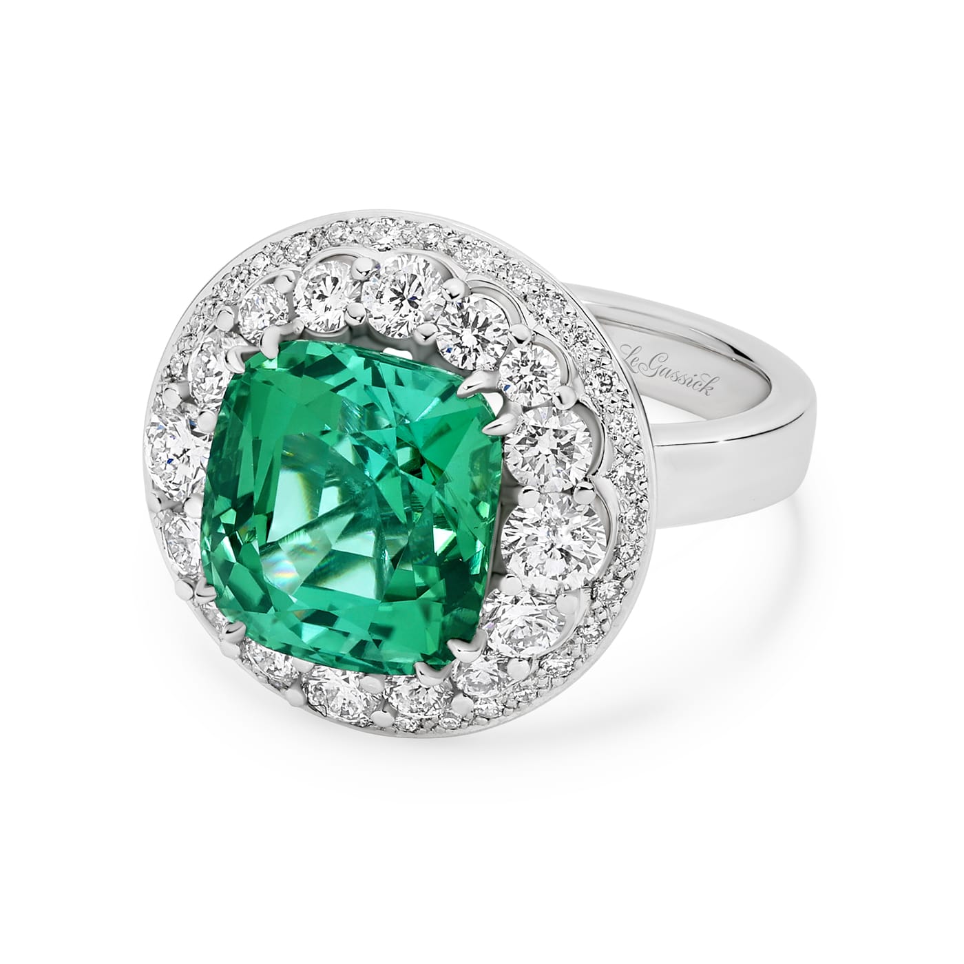 Marihna features a 6.08 carat cushions cut natural green tourmaline poised atop two crowning halos of diamonds. Handcrafted in 18ct white gold with a feature glimpse of yellow gold underneath, her two stunning halos have an enviable total diamond weight of 1.42ct. She was designed and handcrafted by LeGassick's Master Jewellers, Gold Coast, Australia.