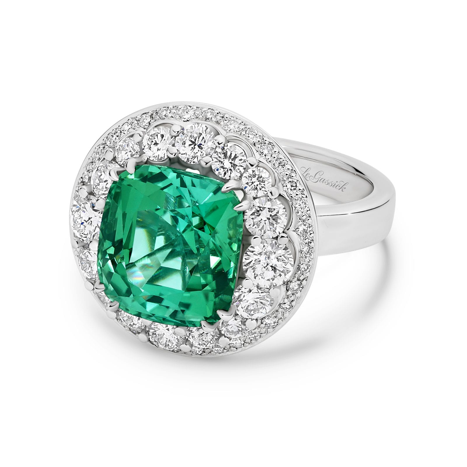Marihna features a 6.08 carat cushions cut natural green tourmaline poised atop two crowning halos of diamonds. Handcrafted in 18ct white gold with a feature glimpse of yellow gold underneath, her two stunning halos have an enviable total diamond weight of 1.42ct. She was designed and handcrafted by LeGassick's Master Jewellers, Gold Coast, Australia.