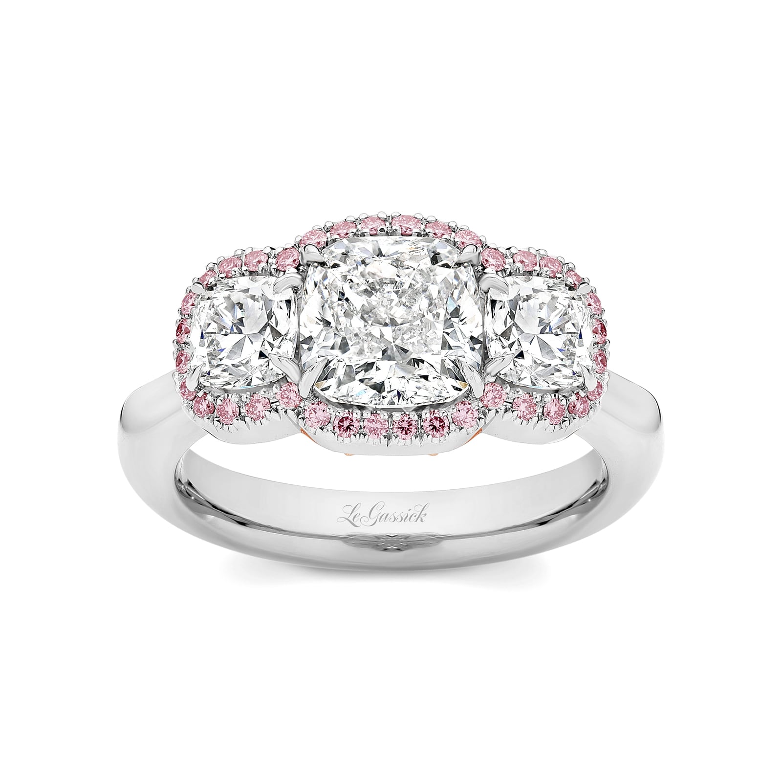 Melody features a trilogy of cushion-cut diamonds which includes a 2.11 carat centre stone with 2 x 0.50ct side stones that have been encircled by a halo of rare natural Argyle pink diamonds. Melody is delicately set with a further 40 round brilliant cut diamonds underneath the trilogy. She was designed and handcrafted by LeGassick's Master Jewellers, Gold Coast, Australia.