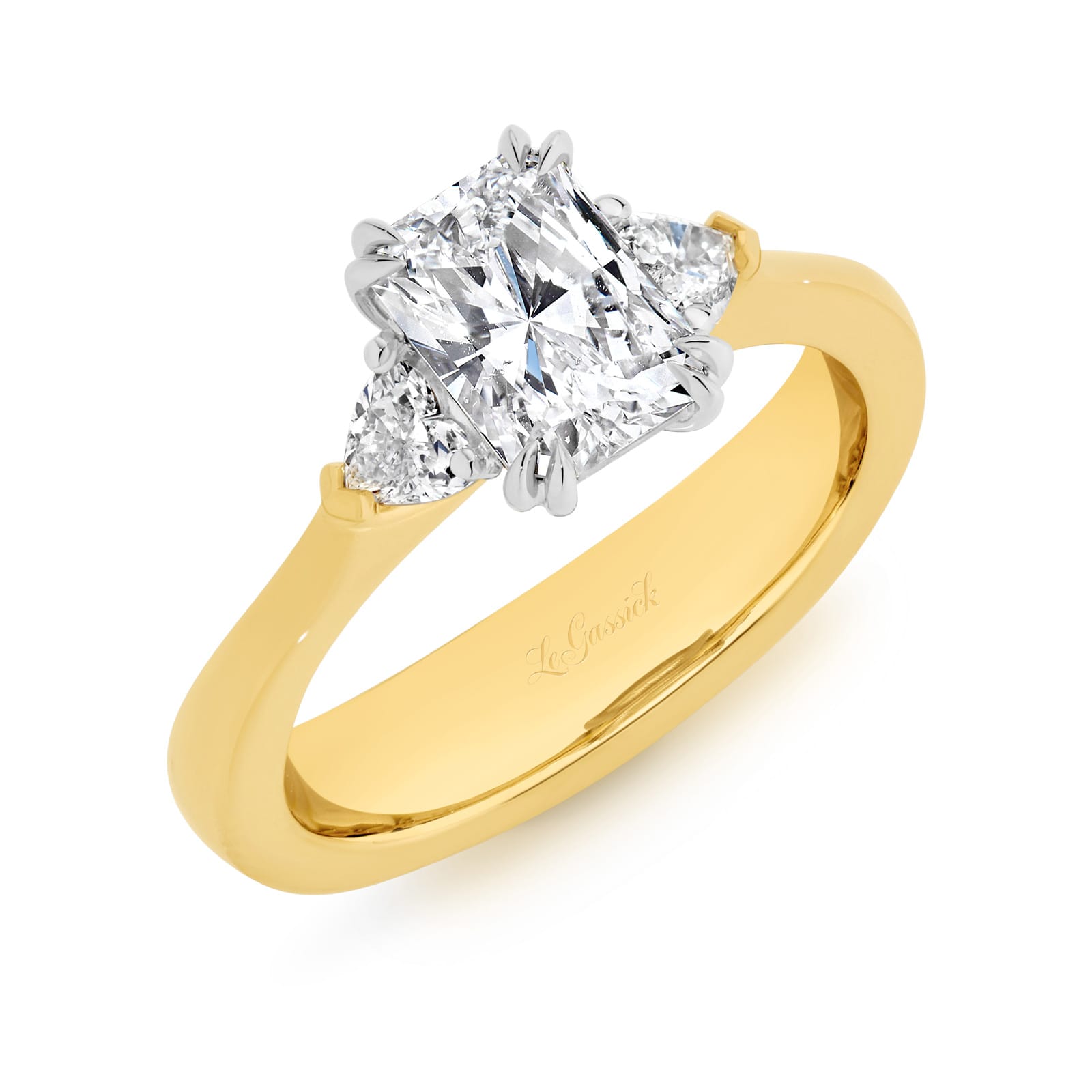 Sierra features a 1.50ct GIA Certified long radiant cut centre diamond, beautifully proportioned on either side with 2 heart shaped diamonds totalling 0.34ct. Handcrafted in 18ct yellow and white gold, she was designed and handcrafted by LeGassick's Master Jewellers, Gold Coast, Australia.