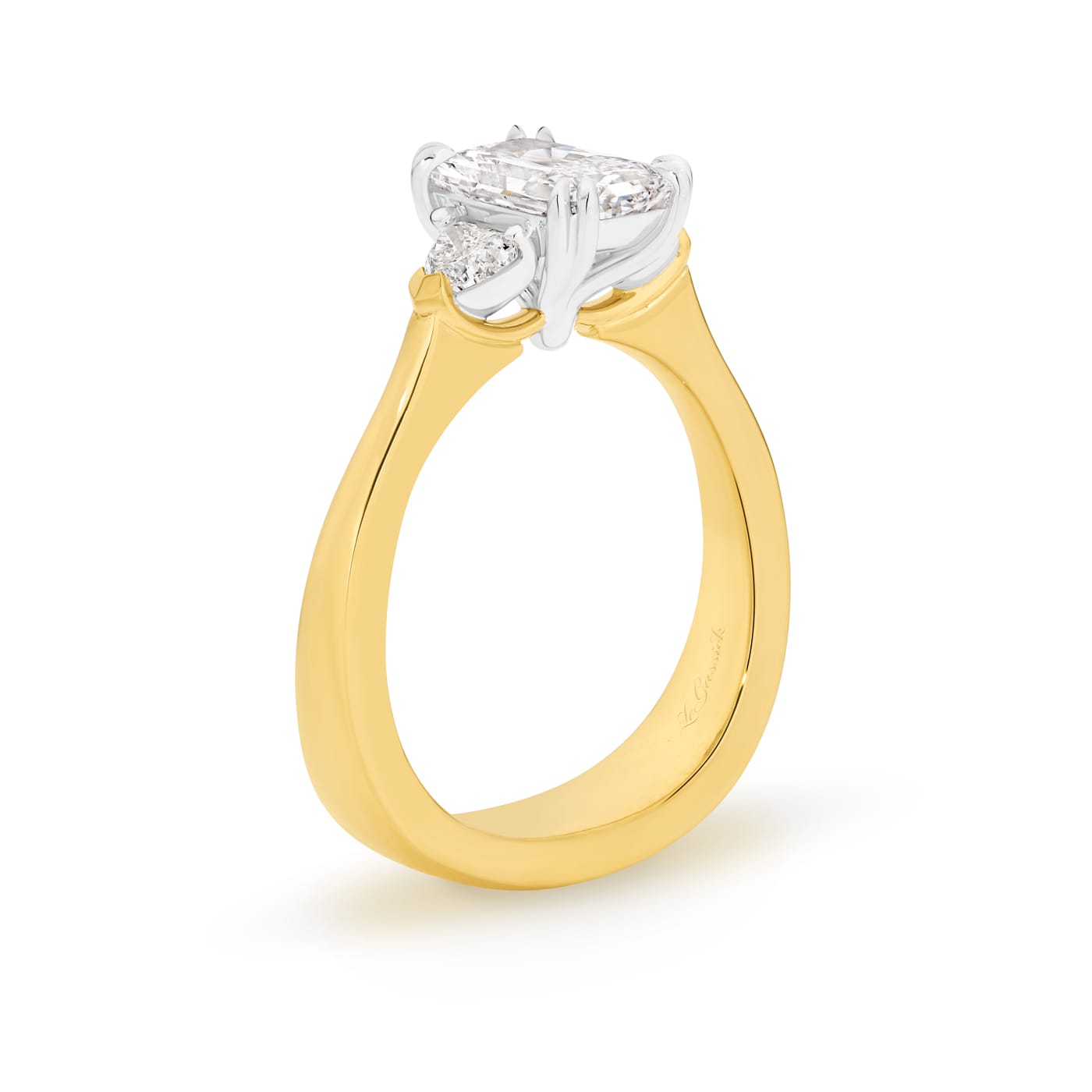 Sierra features a 1.50ct GIA Certified long radiant cut centre diamond, beautifully proportioned on either side with 2 heart shaped diamonds totalling 0.34ct. Handcrafted in 18ct yellow and white gold, she was designed and handcrafted by LeGassick's Master Jewellers, Gold Coast, Australia.