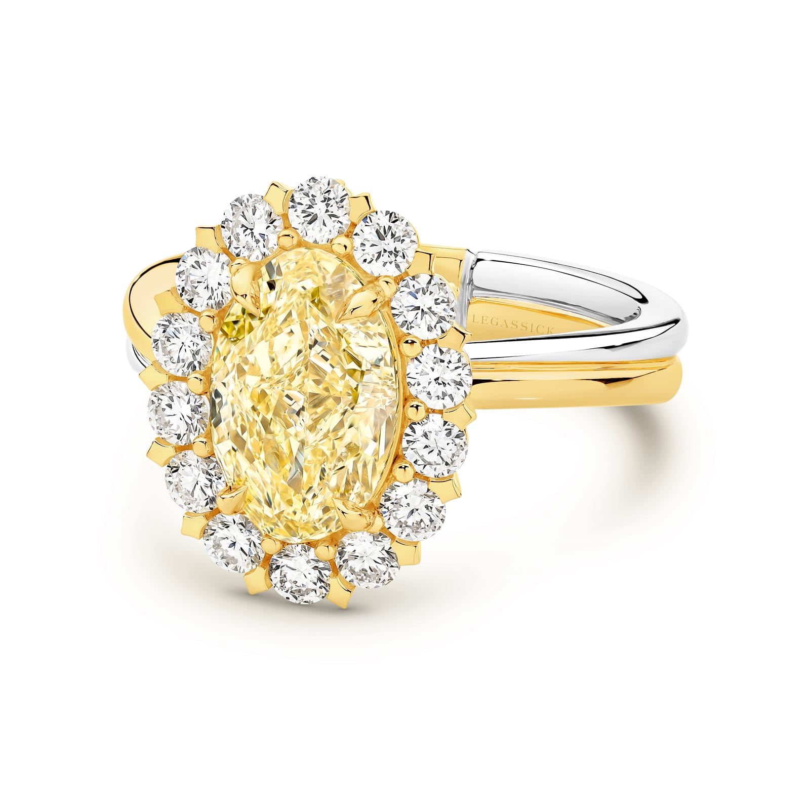 Vincent is a handcrafted ring from LeGassick Fine Jewellery. Vincent has a 2.51ct VSI Oval Natural Fancy Yellow Diamond centre stone encircled by six marquise diamonds and 14 brilliant rounds. All set in yellow and white gold.