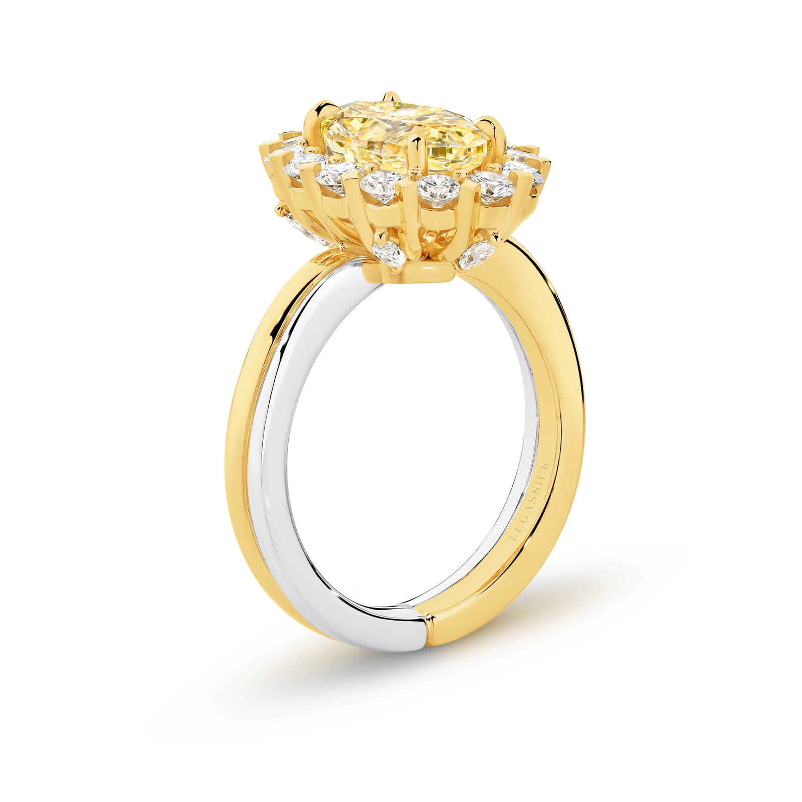 Vincent is a handcrafted ring from LeGassick Fine Jewellery. Vincent has a 2.51ct VSI Oval Natural Fancy Yellow Diamond centre stone encircled by six marquise diamonds and 14 brilliant rounds. All set in yellow and white gold.