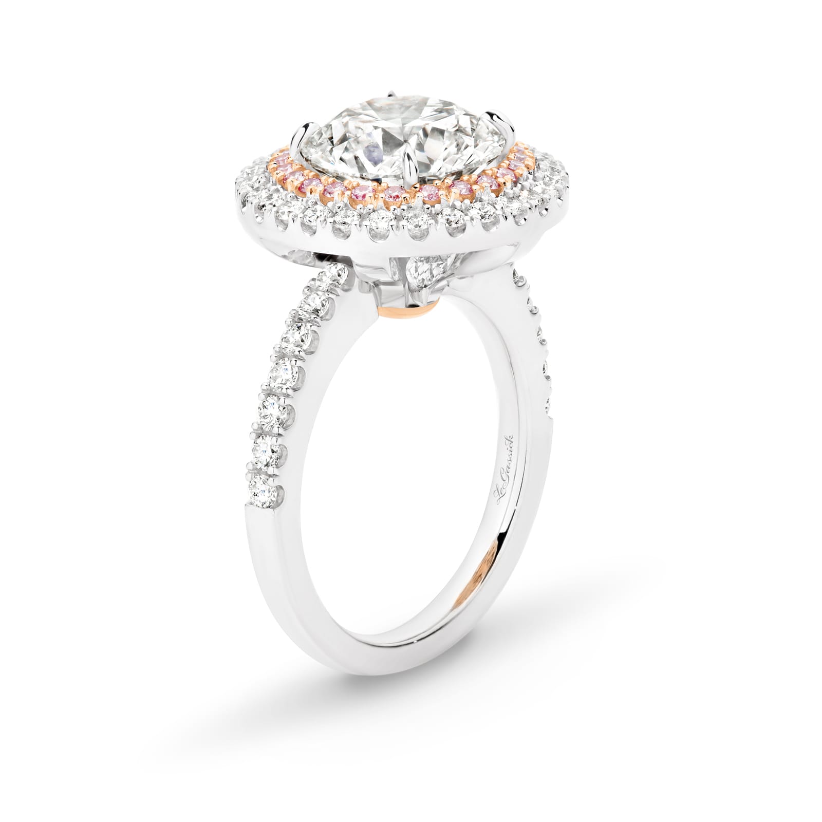 Cleopatra has a stunning 4.51ct round brilliant cut centre diamond surrounded by an inner halo of 24 rare, natural Argyle pink diamonds that, in turn, are showcased by an outer halo of fine white diamonds. She was designed and handcrafted by LeGassick's Master Jewellers, Gold Coast, Australia.
