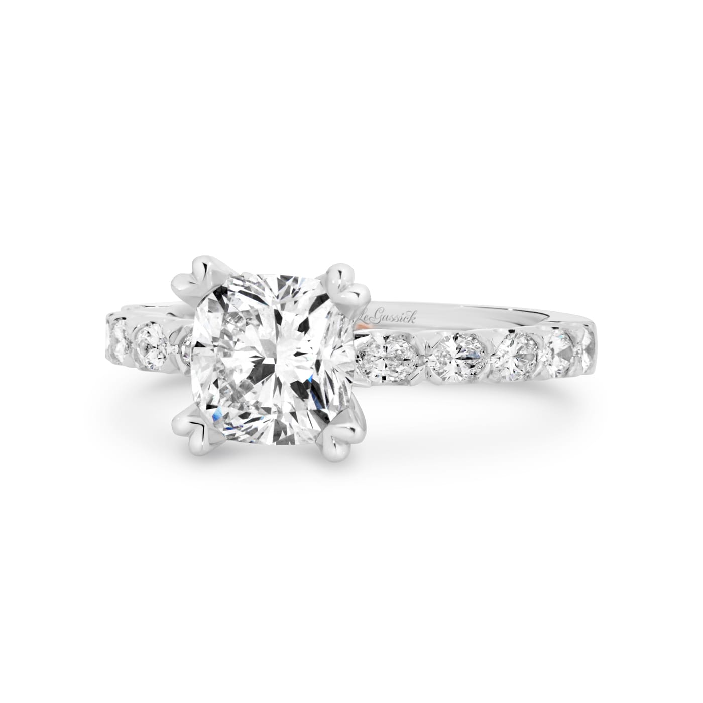 Grace has a 2.04 carat cushion-cut solitaire featuring 10 white oval cut diamonds on the band. Grace also features a natural Argyle pink diamond that has been nestled under her setting. She was designed and handcrafted by LeGassick's Master Jewellers, Gold Coast, Australia.