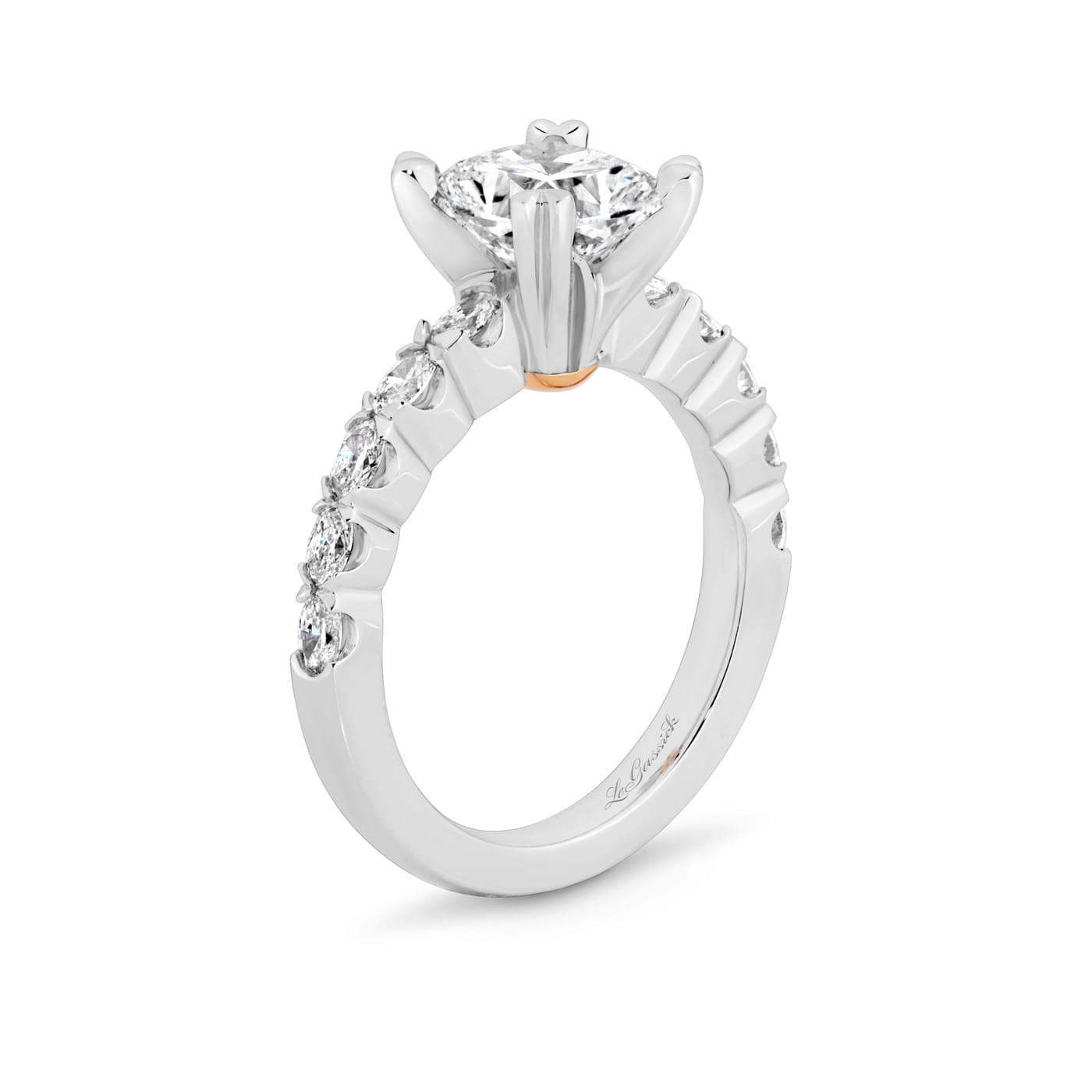 Grace has a 2.04 carat cushion-cut solitaire featuring 10 white oval cut diamonds on the band. Grace also features a natural Argyle pink diamond that has been nestled under her setting. She was designed and handcrafted by LeGassick's Master Jewellers, Gold Coast, Australia.