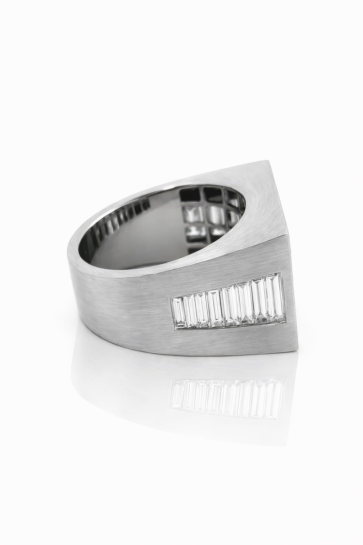 White gold ring with diamond stones on a white background