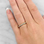 Lady wearing a Claw Set Diamond Band In 18ct Yellow Gold