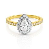 Gold ring with a pear-shaped diamond centre and smaller diamonds on a white background