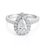 Diamond ring with a pear-shaped centre stone and diamond halo on a white background