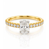 Oval Cut Diamond Solitaire Engagement Ring with Diamond Set Shoulders in Yellow Gold