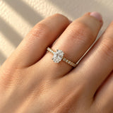 Oval Cut Diamond Solitaire Engagement Ring with Diamond Set Shoulders in Yellow Gold