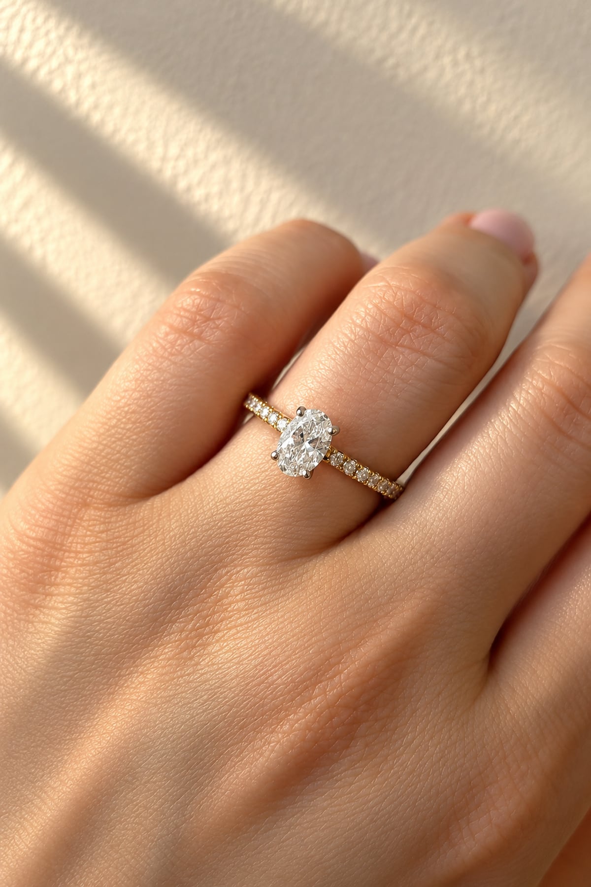 Oval Cut Diamond Solitaire Engagement Ring with Diamond Set Shoulders in Yellow Gold