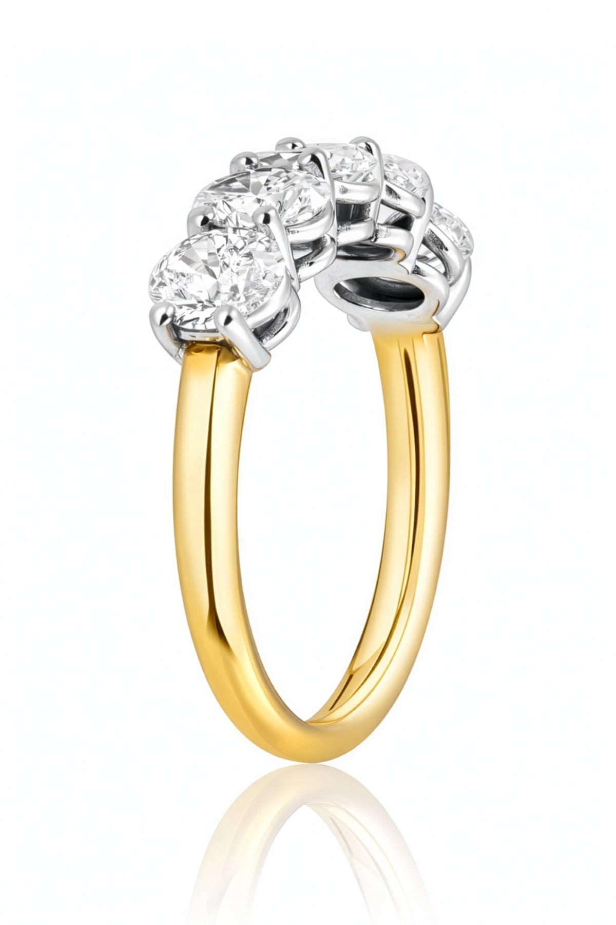 Gold and silver ring with diamonds on a white background