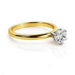 Gold ring with a diamond on a white background