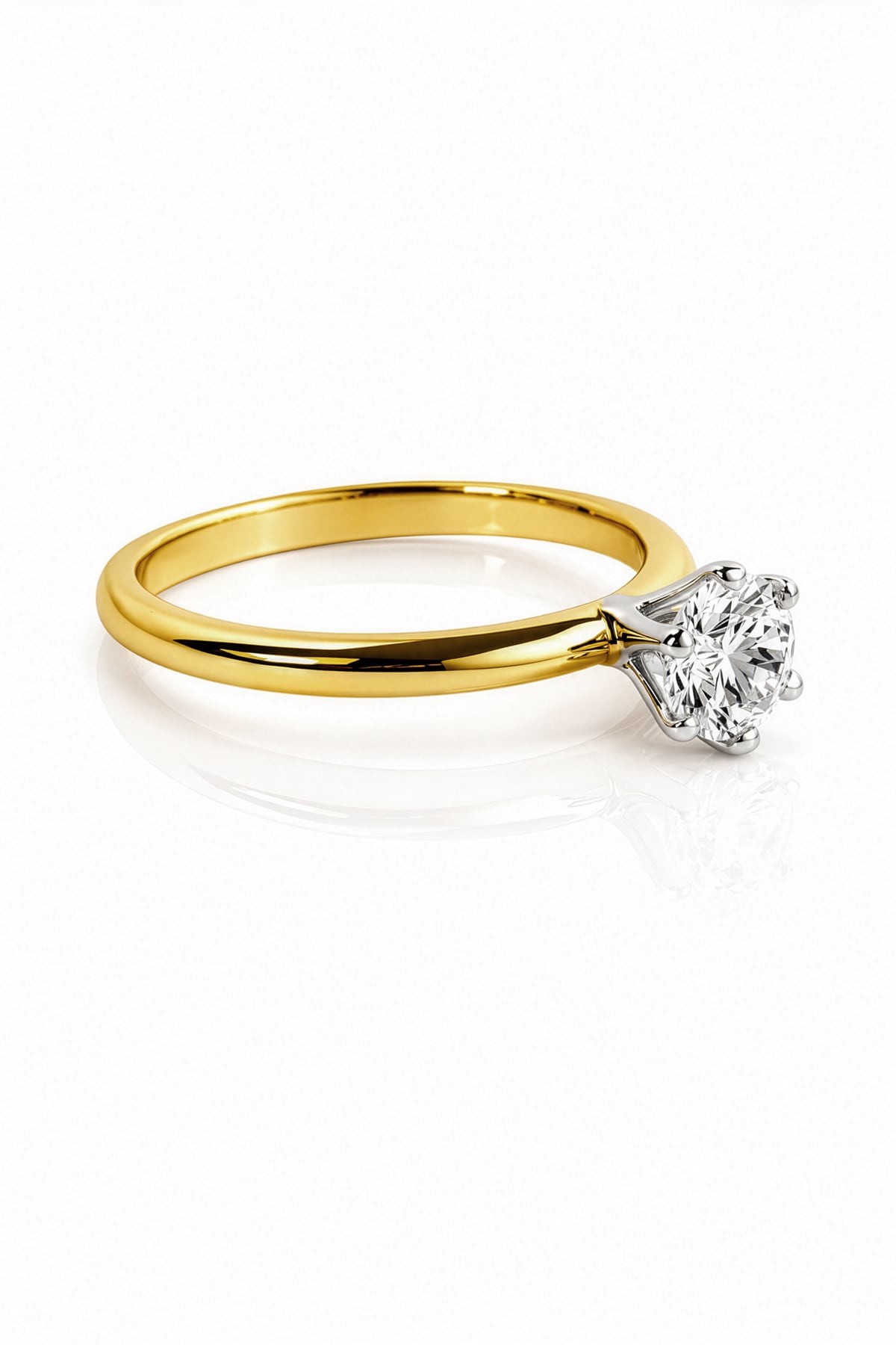 Gold ring with a diamond on a white background