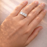 5 Stone gold and lab diamond ring on a a lady's hand