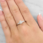 Lady wearing a Emerald Cut Diamond & Baguette Diamond Ring set in 18ct White Gold