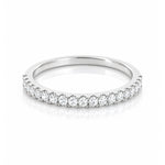 White Gold band with small diamonds on a white background