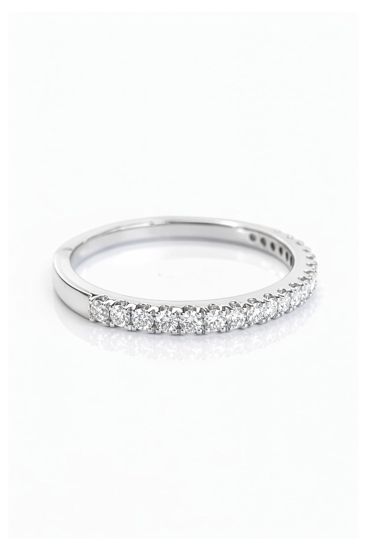 White Gold band with small diamonds on a white background