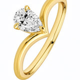 Gold ring with a pear-shaped diamond on a white background