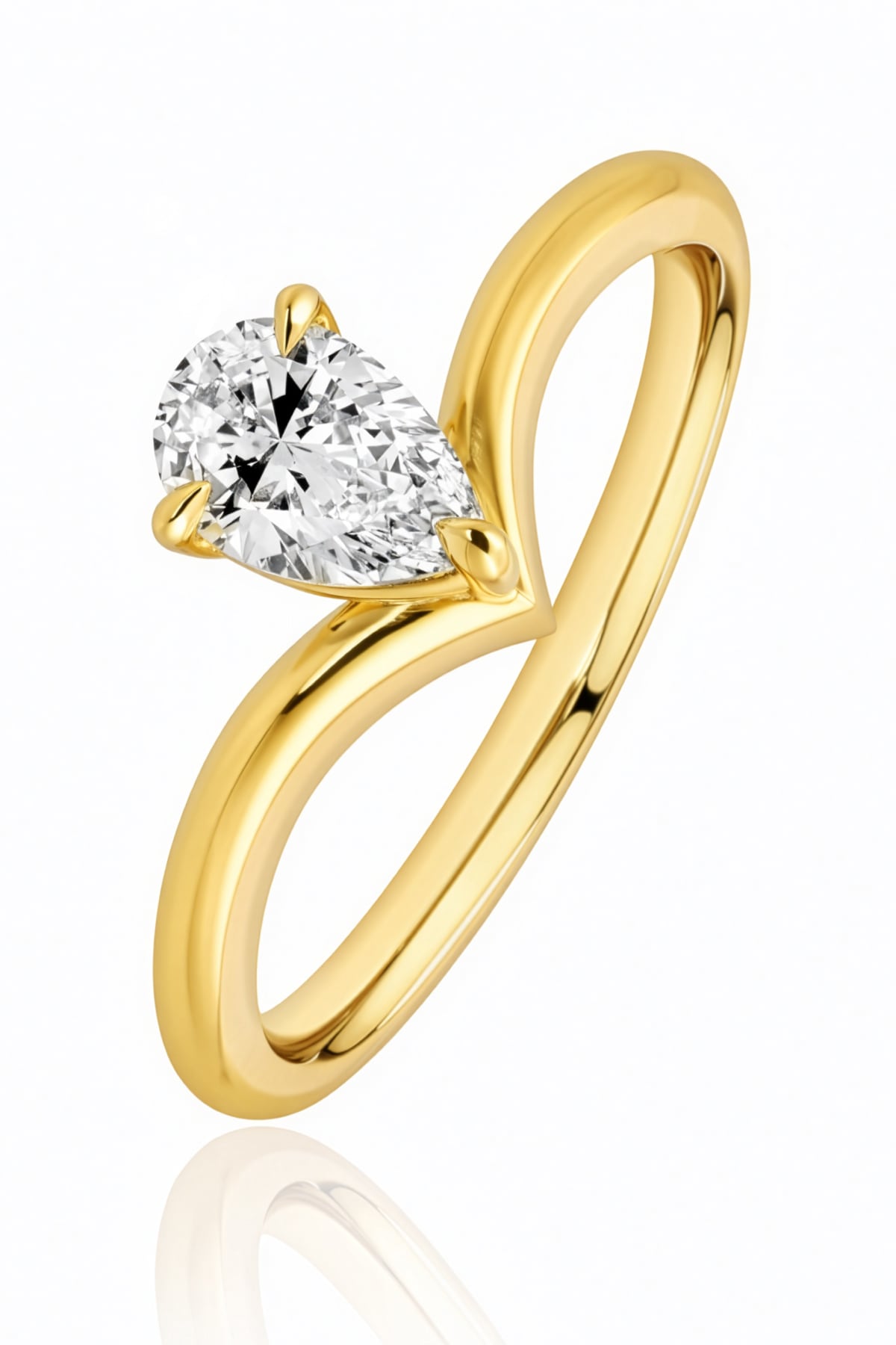 Gold ring with a pear-shaped diamond on a white background