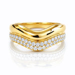 Gold ring with diamond accents on a white background