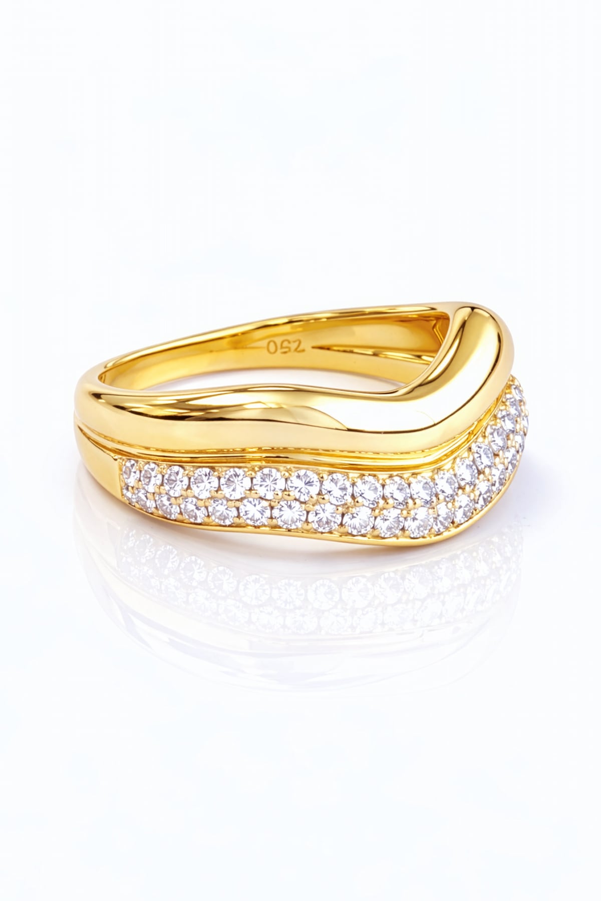 Gold ring with diamond accents on a white background