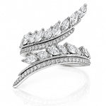 A silver-toned wrap ring featuring multiple curved rows of pavé-set and marquise-cut diamonds, displayed on a clean white background with a soft reflection below.