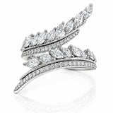 A silver-toned wrap ring featuring multiple curved rows of pavé-set and marquise-cut diamonds, displayed on a clean white background with a soft reflection below.