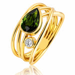 Gold ring with green gemstone and smaller diamond on a white background at LeGassick.