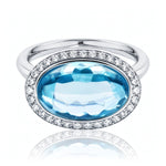 Blue Topaz & Diamond Halo Ring set in 18ct White Gold from LeGassick.