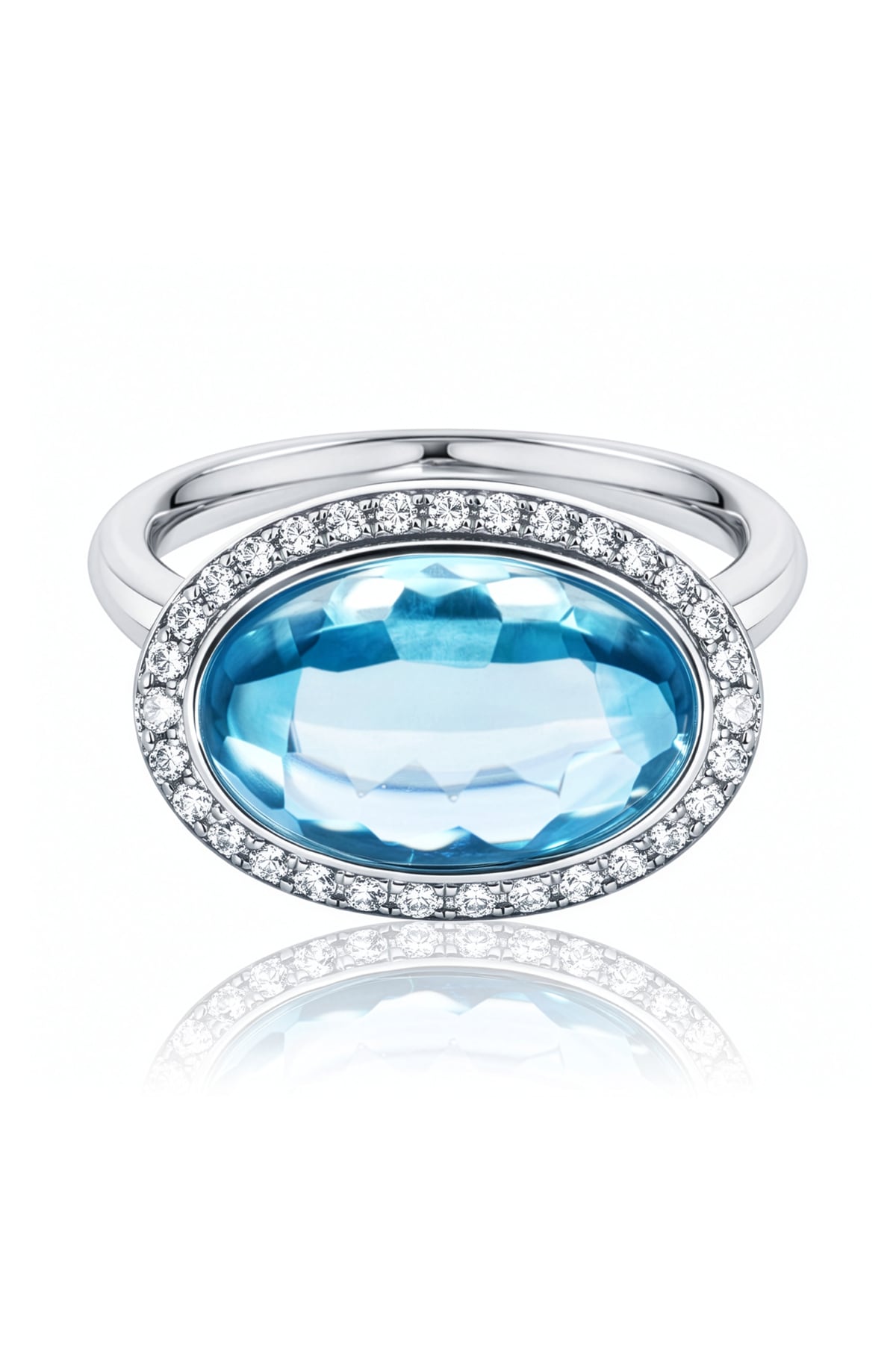 Blue Topaz & Diamond Halo Ring set in 18ct White Gold from LeGassick.