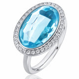 Blue Topaz & Diamond Halo Ring set in 18ct White Gold from LeGassick.