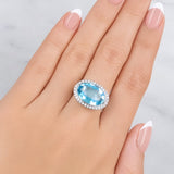 Blue Topaz & Diamond Halo Ring set in 18ct White Gold from LeGassick.