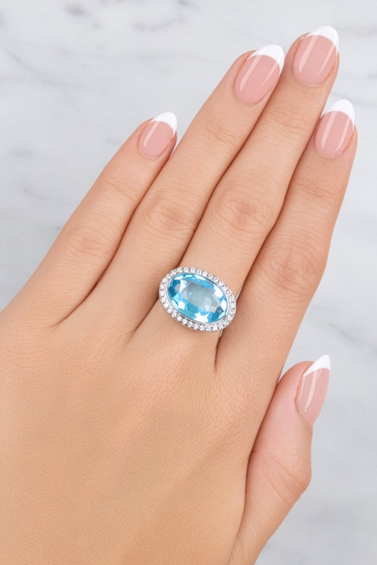 Blue Topaz & Diamond Halo Ring set in 18ct White Gold from LeGassick.