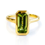 Step Cut Peridot Bezel Set Dress Ring in Yellow Gold