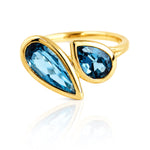 London Blue Topaz Toi et Moi Yellow Gold Ring on a white background