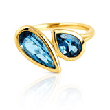 London Blue Topaz Toi et Moi Yellow Gold Ring on a white background