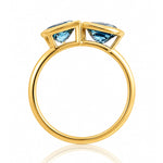 London Blue Topaz Toi et Moi Yellow Gold Ring on a white background