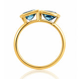 London Blue Topaz Toi et Moi Yellow Gold Ring on a white background